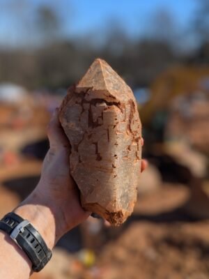 Hand holding large quartz crystal from Moses Hill Arkansas